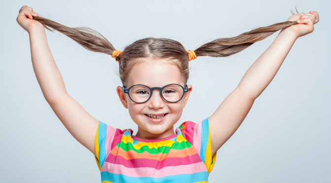 Girl smiling with pig tail