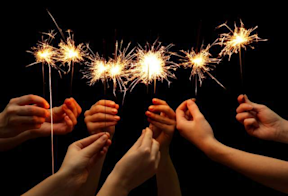 Friends holding fireworks sparklers